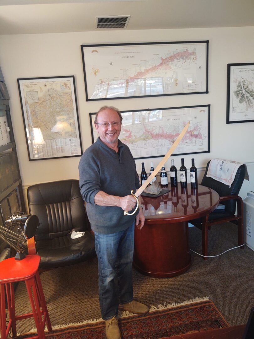 Claude pic Episode #13, Thibaut-Janisson: Claude Thibaut ready to Saber a bottle of Sparkling Wine.
